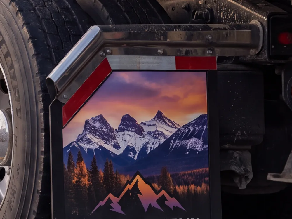 Multi-colour graphic printed across a truck mud flap