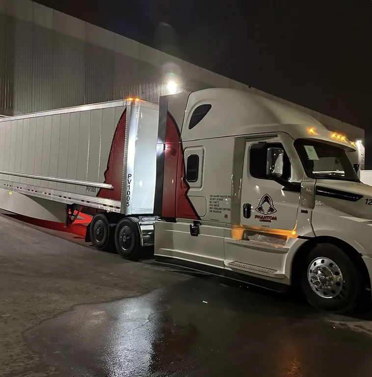 Phantom Logistics semi-truck wrap — full commercial fleet branding